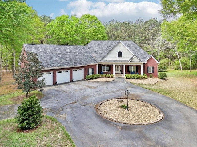 270 Morrow Rd, Newborn, GA 30056 - view of front of property with curved driveway, an attached garage, a porch, a front lawn, and a shingled roof