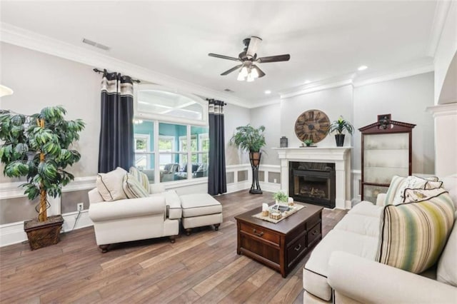 270 Morrow Rd, Newborn, GA 30056 - living room featuring a fireplace, ceiling fan, wood-type flooring, crown molding, and recessed lighting