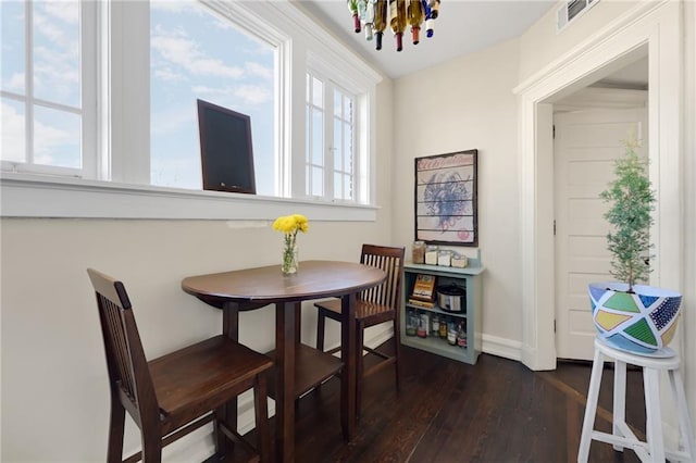 746 N Highland Ave NE Unit 7, Atlanta, GA 30306 - dining space featuring plenty of natural light, a chandelier, dark wood-style floors, and baseboards