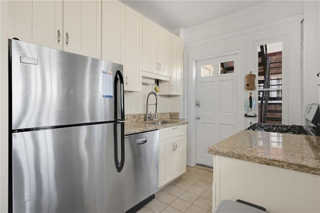 746 N Highland Ave NE Unit 7, Atlanta, GA 30306 - kitchen with appliances with stainless steel finishes, a sink, ornamental molding, white cabinets, and light stone counters
