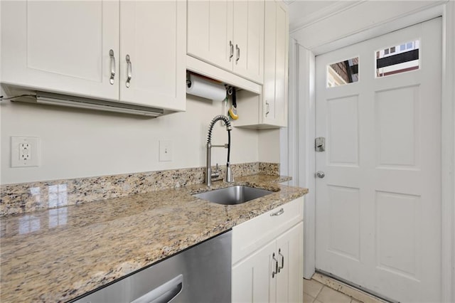 746 N Highland Ave NE Unit 7, Atlanta, GA 30306 - kitchen featuring a sink, white cabinetry, stainless steel dishwasher, light tile patterned floors, and light stone counters