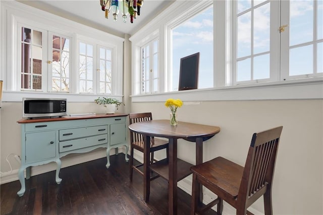 746 N Highland Ave NE Unit 7, Atlanta, GA 30306 - dining area featuring dark wood-style flooring and a chandelier