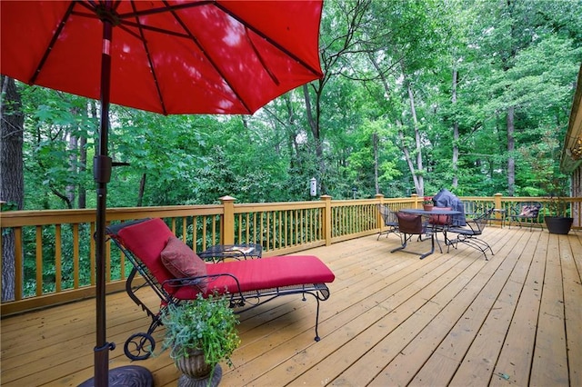 wooden deck with outdoor dining area