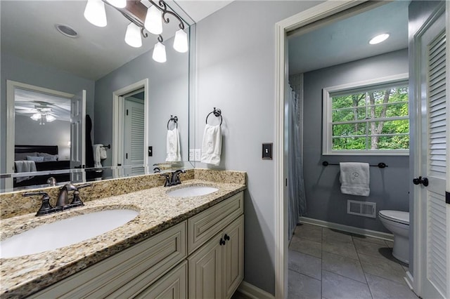 full bath featuring baseboards, visible vents, a sink, and ensuite bathroom