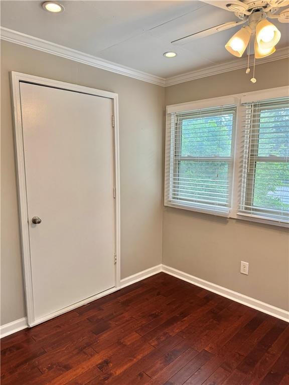 121 Brittany Ct, Duluth, GA 30096 - empty room featuring dark wood finished floors, ornamental molding, baseboards, a ceiling fan, and recessed lighting