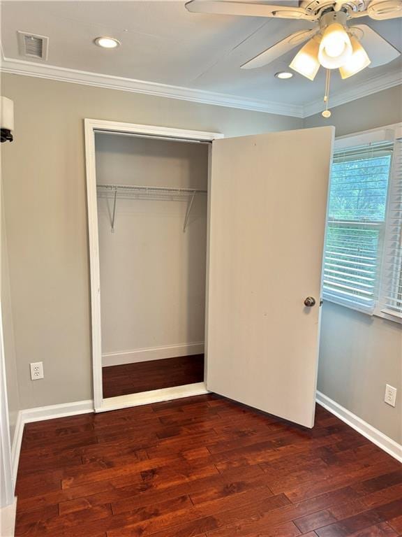 121 Brittany Ct, Duluth, GA 30096 - unfurnished bedroom featuring ornamental molding, a closet, wood finished floors, a ceiling fan, and baseboards