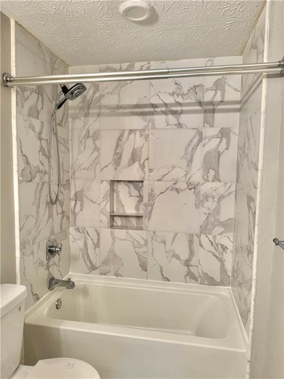 121 Brittany Ct, Duluth, GA 30096 - full bath with toilet, a textured ceiling, and washtub / shower combination