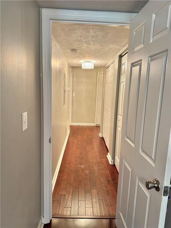 121 Brittany Ct, Duluth, GA 30096 - corridor featuring baseboards, hardwood / wood-style flooring, and a textured ceiling