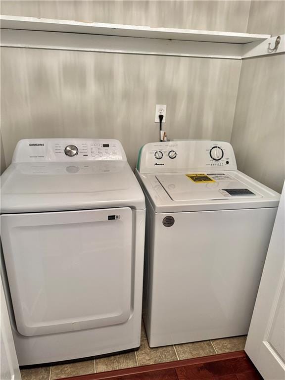 121 Brittany Ct, Duluth, GA 30096 - washroom featuring washing machine and clothes dryer and tile patterned floors