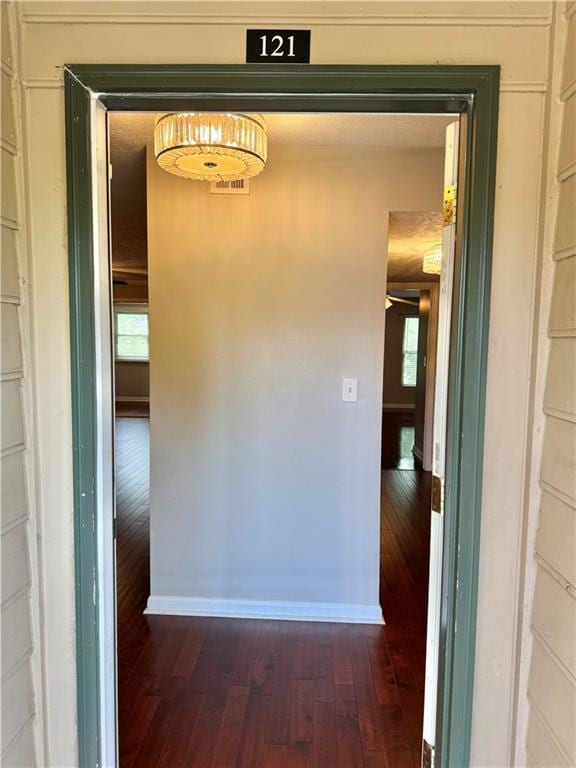 121 Brittany Ct, Duluth, GA 30096 - hall with dark wood finished floors and baseboards