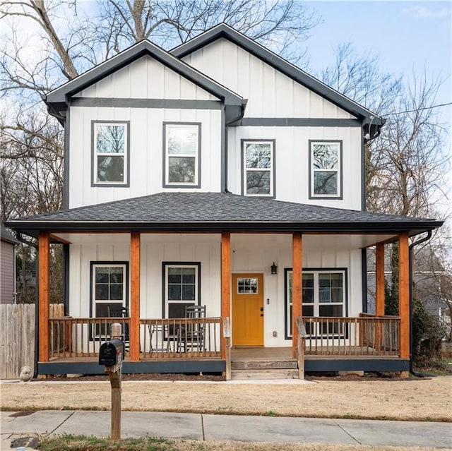 view of front of house featuring covered porch, a shingled roof, and board and batten siding