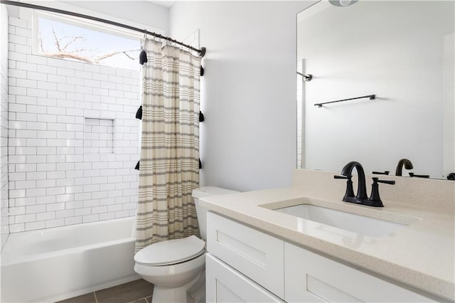 full bathroom featuring toilet, shower / tub combo with curtain, and vanity