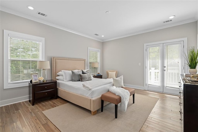bedroom with french doors, access to outside, multiple windows, ornamental molding, and baseboards