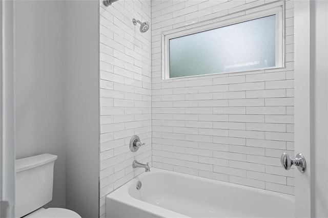 bathroom featuring toilet and shower / bath combination