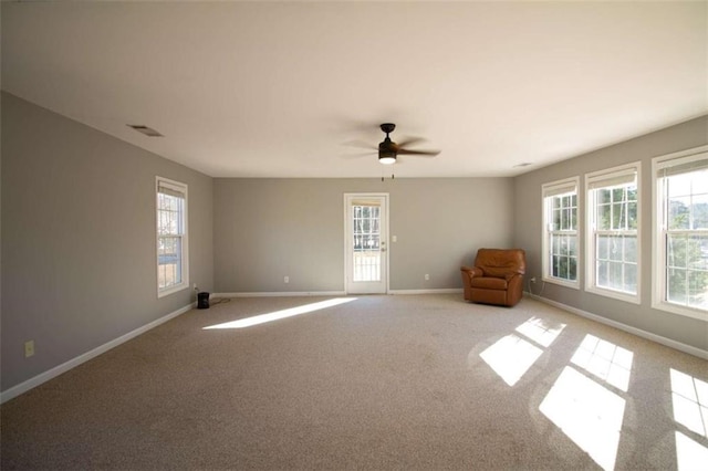 carpeted empty room with ceiling fan