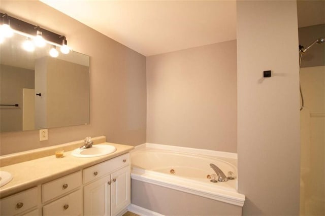 bathroom featuring vanity and a tub to relax in