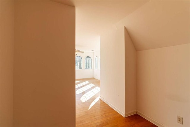 hallway with hardwood / wood-style floors