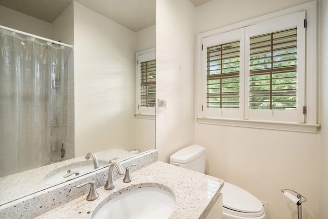 2556 Defoors Ferry Rd NW, Atlanta, GA 30318 - bathroom with toilet, vanity, and curtained shower