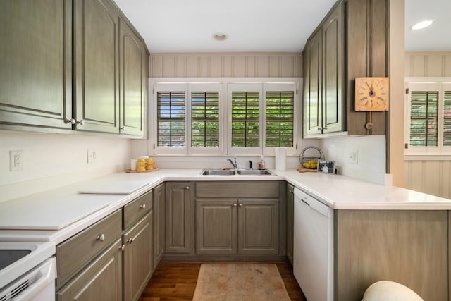 2556 Defoors Ferry Rd NW, Atlanta, GA 30318 - kitchen featuring dishwasher, a sink, dark wood-style flooring, light countertops, and recessed lighting