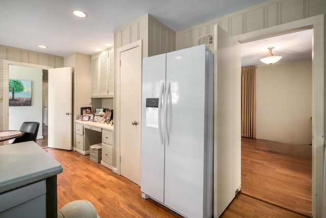 2556 Defoors Ferry Rd NW, Atlanta, GA 30318 - kitchen with white refrigerator with ice dispenser, light countertops, light wood-type flooring, and recessed lighting