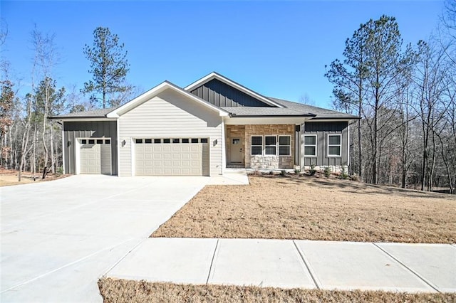 view of front of house featuring concrete driveway, board and batten siding, and an attached garage