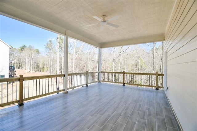 wooden deck with ceiling fan