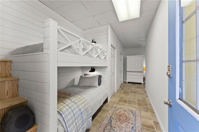bedroom featuring baseboards