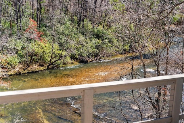 view of water feature featuring a wooded view