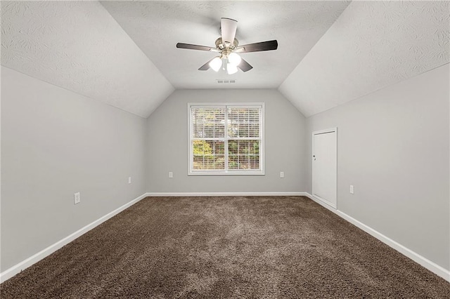 7165 Jonsway, Cumming, GA 30041 - bonus room featuring a textured ceiling, vaulted ceiling, carpet, ceiling fan, and baseboards