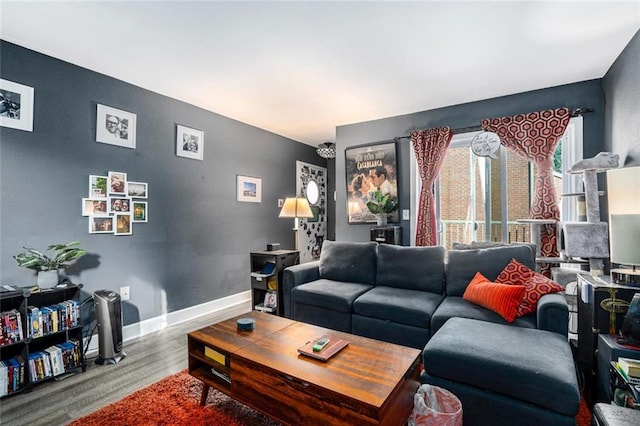 living room with baseboards and wood finished floors