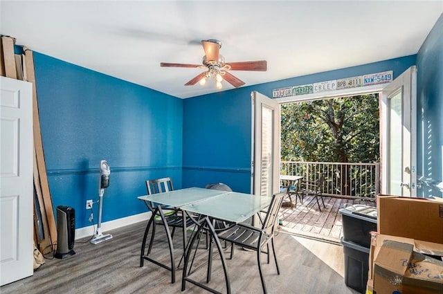 dining space featuring baseboards, ceiling fan, and wood finished floors