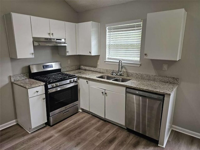 3763 Waldrop Hills Dr, Decatur, GA 30034 - kitchen with dark wood-style flooring, white cabinets, stainless steel appliances, under cabinet range hood, and a sink