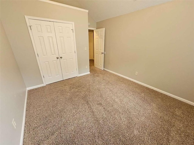 3763 Waldrop Hills Dr, Decatur, GA 30034 - unfurnished bedroom with baseboards, lofted ceiling, a closet, and carpet flooring