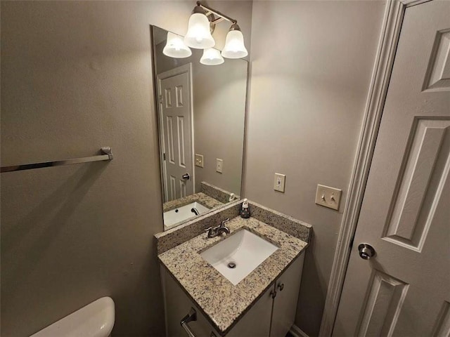 3763 Waldrop Hills Dr, Decatur, GA 30034 - half bathroom with toilet, vanity, and an inviting chandelier