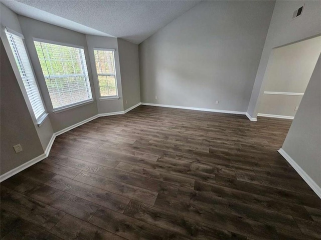 3763 Waldrop Hills Dr, Decatur, GA 30034 - unfurnished room with dark wood-style flooring, baseboards, lofted ceiling, and a textured ceiling