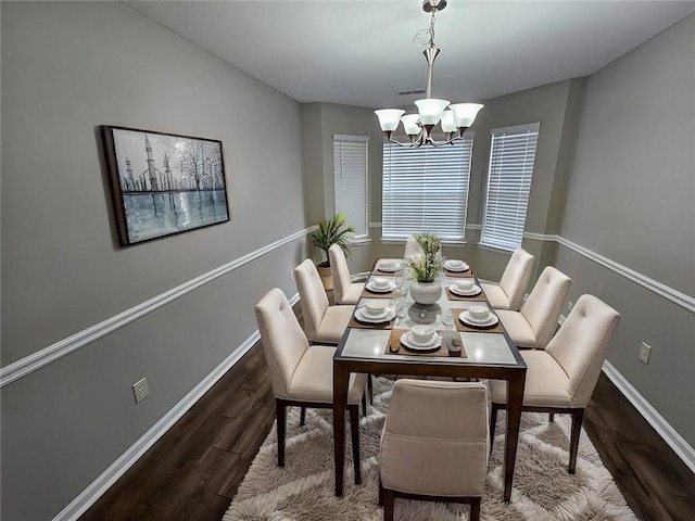 3763 Waldrop Hills Dr, Decatur, GA 30034 - dining room with baseboards, visible vents, wood finished floors, and a chandelier