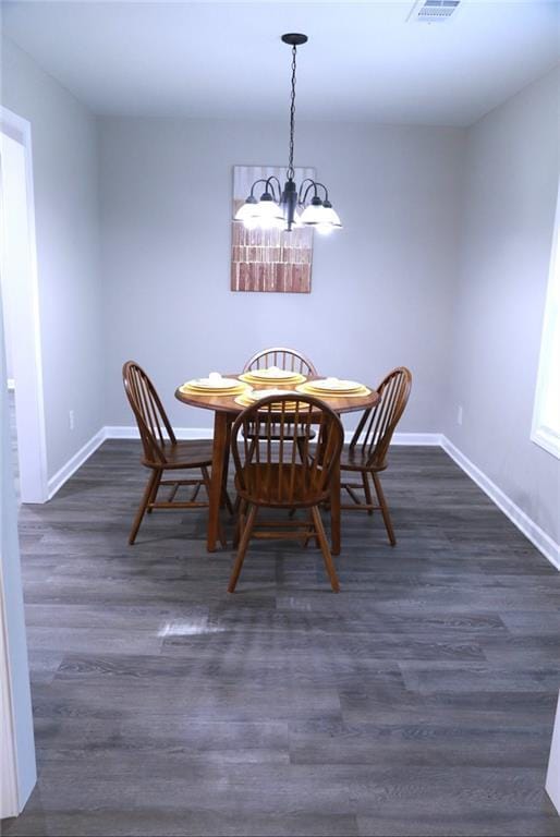 414 E 17th St E, Rome, GA 30161 - dining room with a chandelier, baseboards, and dark wood finished floors