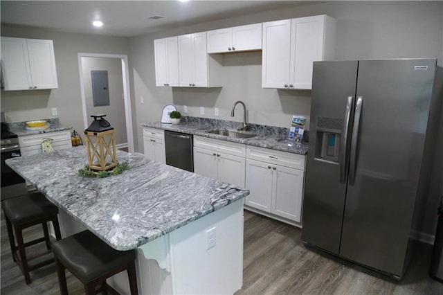 414 E 17th St E, Rome, GA 30161 - kitchen featuring stainless steel fridge, dishwashing machine, a sink, electric panel, and white cabinets