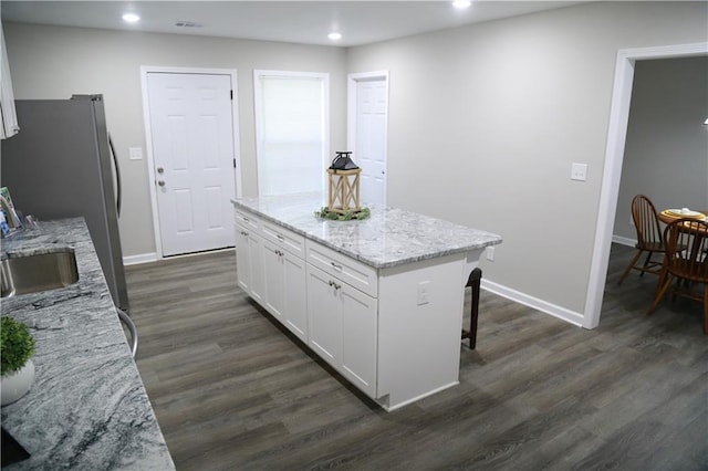 414 E 17th St E, Rome, GA 30161 - kitchen with white cabinetry, dark wood-type flooring, recessed lighting, baseboards, and a center island
