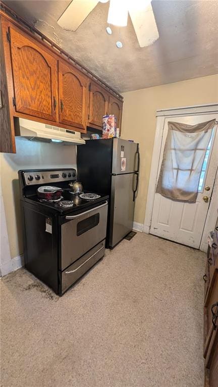 kitchen featuring light carpet, black electric range oven, stainless steel refrigerator, and ceiling fan