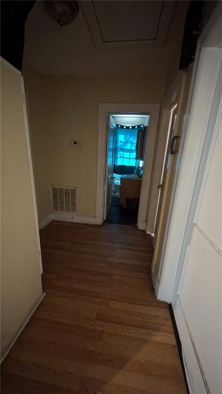 corridor featuring hardwood / wood-style flooring