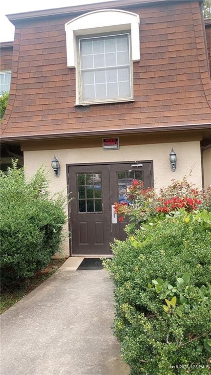 80 Place Fontaine, Lithonia, GA 30038 - entrance to property with stucco siding and roof with shingles