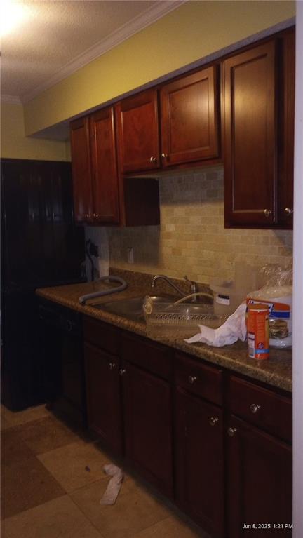 80 Place Fontaine, Lithonia, GA 30038 - kitchen featuring crown molding, decorative backsplash, and black dishwasher