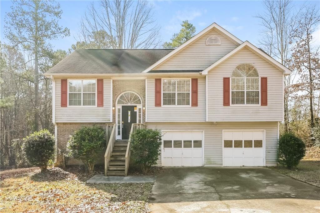 split foyer home featuring a garage