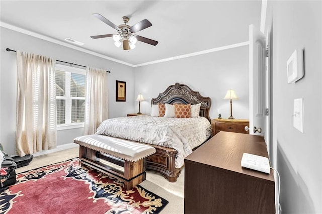 bedroom featuring crown molding, light colored carpet, visible vents, ceiling fan, and baseboards