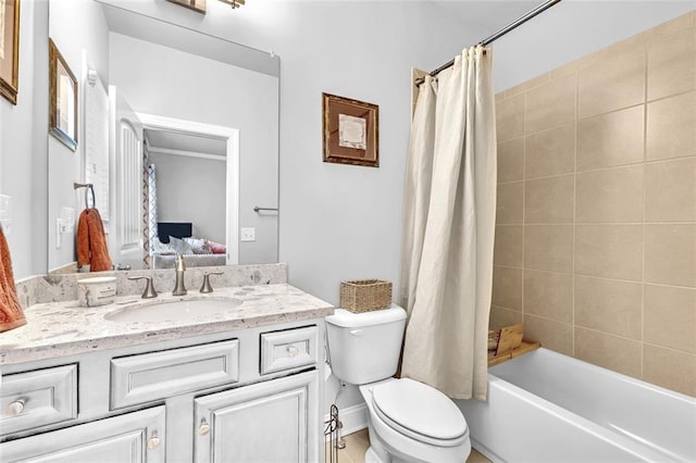 full bathroom featuring toilet, shower / bath combo with shower curtain, vanity, and ensuite bathroom