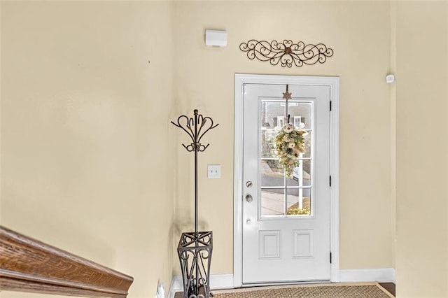 entrance to property featuring stucco siding