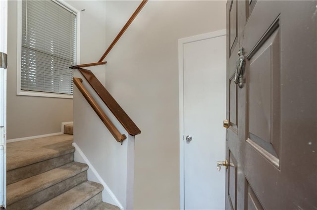 stairs featuring baseboards