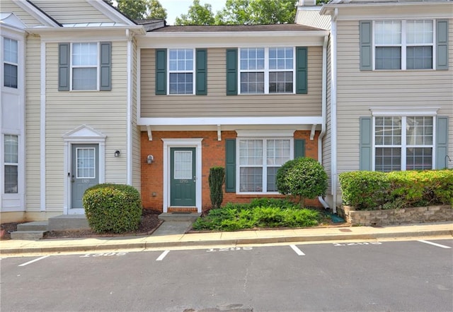 1295 Kilmington Ct, Alpharetta, GA 30009 - view of property with uncovered parking and brick siding