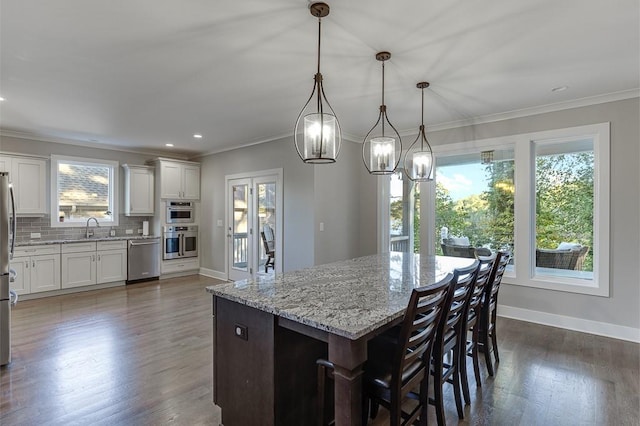 3441 Shoreland Dr, Buford, GA 30518 - kitchen featuring stainless steel appliances, a sink, baseboards, decorative backsplash, and ornamental molding